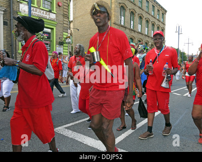 Costumed dancers from Huddersfield Carnival 2013 African Caribbean parade street party Stock Photo