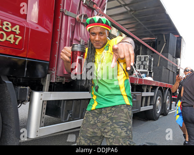 Costumed dancer with drink from Huddersfield Carnival 2013 African Caribbean parade street party Stock Photo