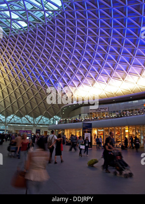 View of the steel lattice-work roof structure engineered by Arup, on the western concourse of King's Cross railway Station. Stock Photo