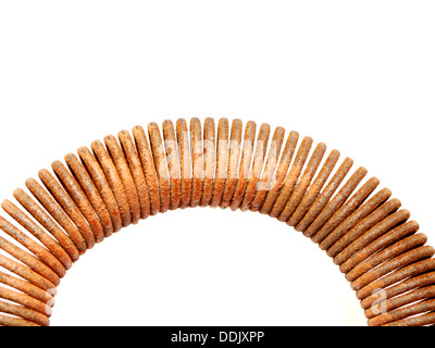 Rusty spring on a white background Stock Photo