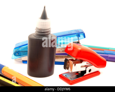 Felt-tip pens, stapler and paint on a white background Stock Photo
