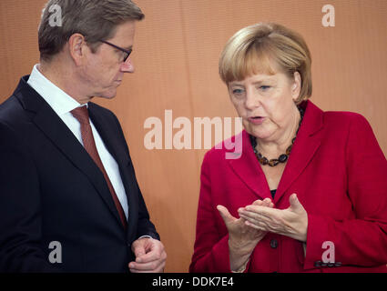 the German Chancellery, Berlin, Germany. 04th Sep, 2013. German Chancellor Angela Merkel and Foreign Minister Guido Westerwelle chat before the cabinet meeting at the German Chancellery, Berlin, Germany, 04 September 2013. Photo: Kay Nietfeld/dpa/Alamy Live News Stock Photo