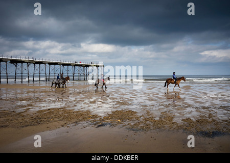 Horse Riding on the beach at Saltburn by the Sea Stock Photo
