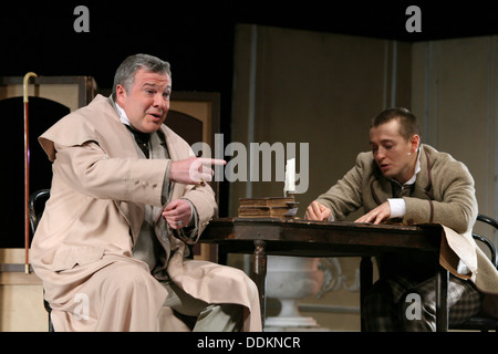 Russian actors Sergey Bezrukov (R) and Mikhail Khomyakov (L). Moscow Theatre of Oleg Tabakov. Play 'Even a Wise Man Stumbles'. Stock Photo