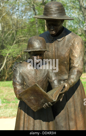 Statue of freed slave woman teaching a girl to read at Union Army's Contraband Camp in Corinth MS, 1862-1864. Digital photograph Stock Photo