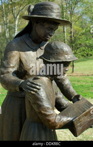 Statue of freed slave woman teaching a girl to read at Union Army's Contraband Camp in Corinth MS, 1862-1864. Digital photograph Stock Photo