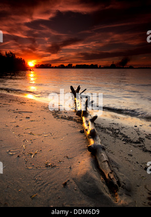 The sun setting over the Detroit River from Windsor, Ontario. Stock Photo