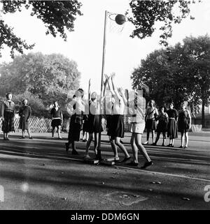 Netball game at Coram's Fields School, Camden, London, 1959. Artist: Henry Grant Stock Photo