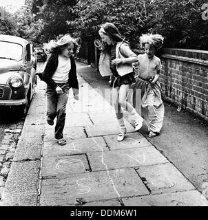 Children playing hopscotch on a London street, c1970. Artist: Henry Grant Stock Photo