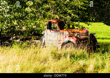 old wrecking car in countryside in Maine, Usa Stock Photo