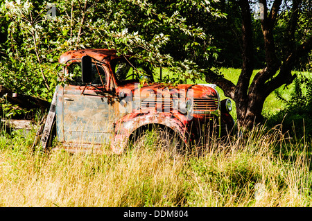 old wrecking car in countryside in Maine, Usa Stock Photo