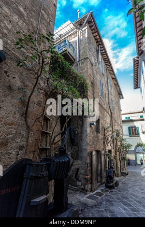 Orvieto in Umbria, Italy, narrow street with small shops. Stock Photo