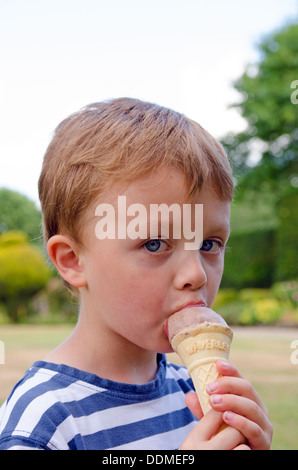 Boy eating ice cream cone Stock Photo