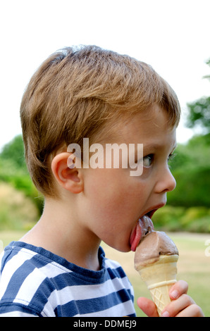 Boy eating ice cream cone Stock Photo