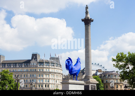 Trafalgar Square in London showing Nelson's Column, London's Eye and a Blue Cockerel  statue Stock Photo