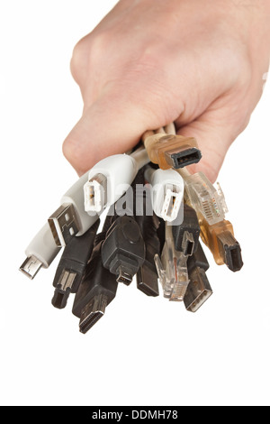 bunch of computer cables with sockets in hand isolated on a white background Stock Photo