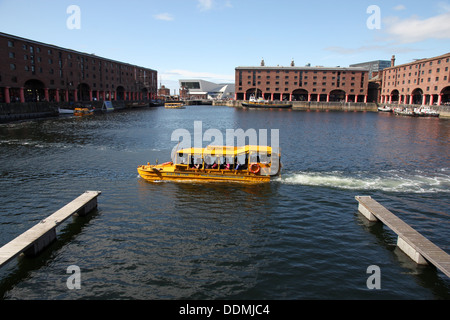 A Yellow Duckmarine craft afloat in Albert Dock, Liverpool, UK. Stock Photo