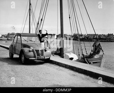 A Citroën 2CV on the quay at a harbour, c1957. Artist: Unknown Stock Photo