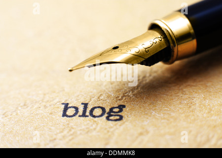 Blog text on paper with pen Stock Photo