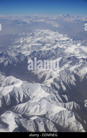 aerial view of Karakoram mountains of Sinkiang, China, you can see frozen peaks and deep valley.  Stock Photo