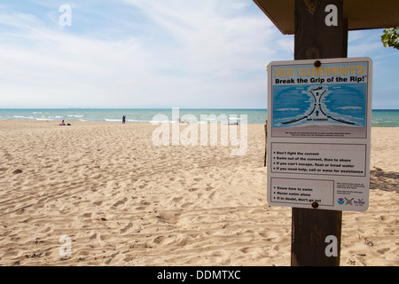 Rip current warning sign. Indiana Dunes State Park. Stock Photo