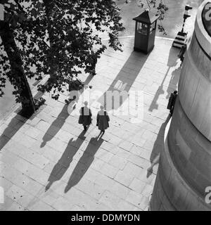 Pedestrians on the Victoria Embankment, London, seen from Waterloo Bridge. Artist: SW Rawlings Stock Photo