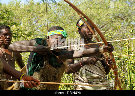 Hadzabe, Hadza tribe hunting with bow and arrow Tanzania Collection Stock Photo