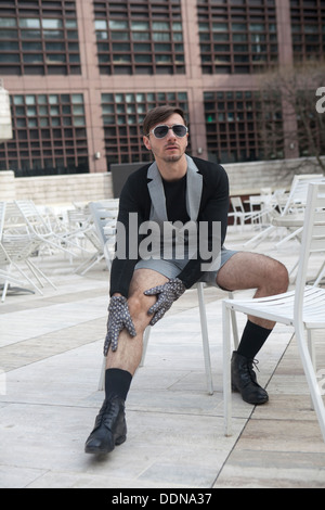 cheeky young man in fashionable glasses Stock Photo