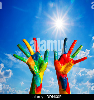 Painted hands up, colorful fun - creativity / happiness / diversity concept. Stock Photo