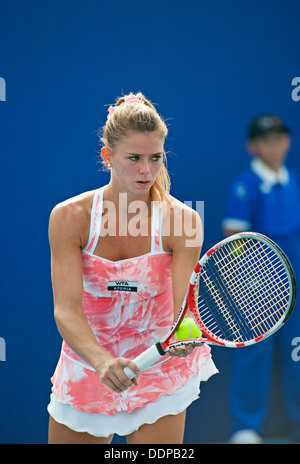 Camila Giorgi of Italy prepares to serve to Romina Oprandi at the China Open Tennis tournament in Beijing on 2/10/2012 Stock Photo