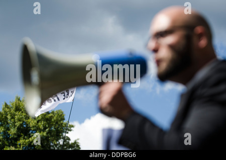 Out of focus image of Simon Welsh speaking at Belt It Out Balcombe event, Balcombe, West Sussex, for the anti-fracking campaign, Stock Photo