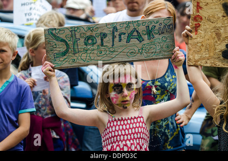 Young girl with sign at 'Belt It Out Balcombe' event, Balcombe, West Sussex, for the anti-fracking campaign, 11th August 2013 Stock Photo