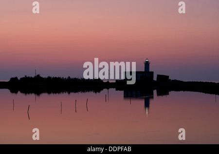 The Punta Lingua Lighthouse at sunrise on the island of Salina in the Aeolian Islands, Sicily, Italy Stock Photo