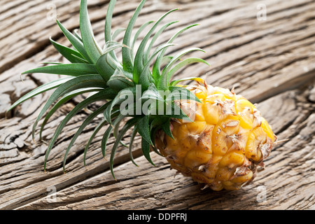 Pineapple on a wooden table. Stock Photo