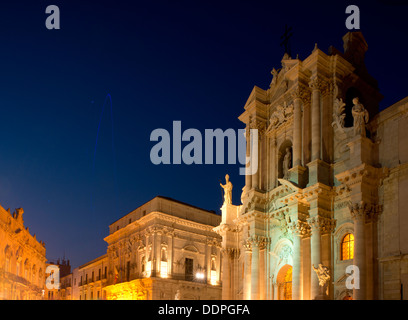 The Sicilian Baroque facade of the Cathedral of Santa Maria delle Colonne at dusk in Ortigia, Syracuse, Sicily, Italy Stock Photo
