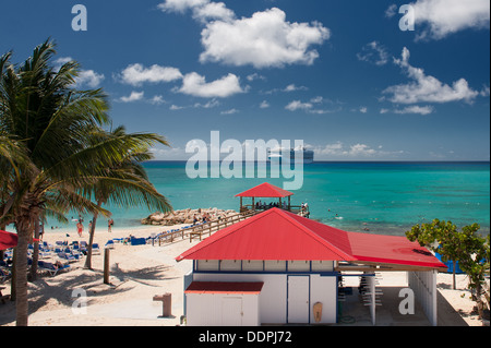 Cruise Ship Docked off the coast of a Caribbean Village Stock Photo