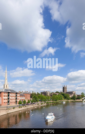 Cruiser on the River Severn at Worcester with Worcester Cathedral in the distance, Worcestershire, England, UK Stock Photo