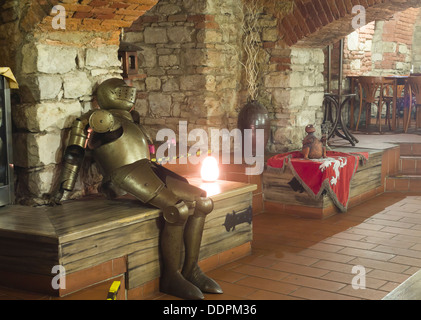 the knight's armor against the stone walls Stock Photo