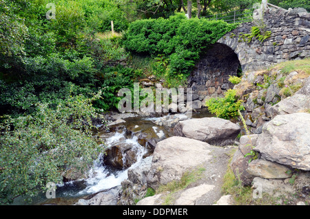 Miners Bridge across Church Beck in the Copper Mines Valley above Coniston, Lake District, England. Stock Photo