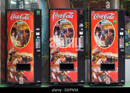 Three in a Row Vintage Coca Cola Vending Machine Stock Photo