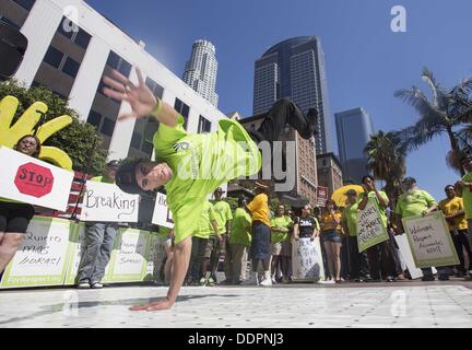 Los Angeles, USA. 5th Sep, 2013. Walmart workers and supporters take part in a nationwide day of protests on Thursday, September 5, 2013 in downtown Los Angeles to call for better jobs and higher wages. Credit:  Ringo Chiu/ZUMAPRESS.com/Alamy Live News Stock Photo