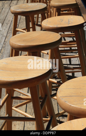 Empty wooden bar stools at a tiki bar in Point Pleasant Beach, New Jersey, USA Stock Photo