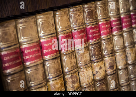 Old encyclopedias on a book shelf in the Gatehouse at Kenilworth Castle Stock Photo