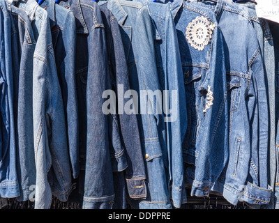 Denim jackets hang on sale in Brighton's North Laine Stock Photo