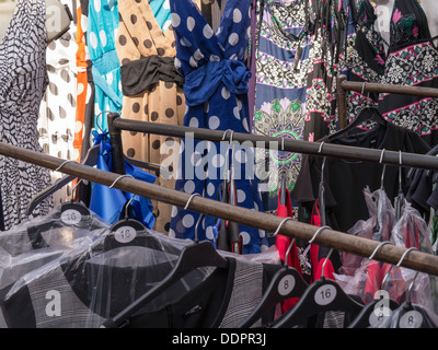 Dresses on sale at Petticoat Lane Market in London, August 2013 Stock Photo