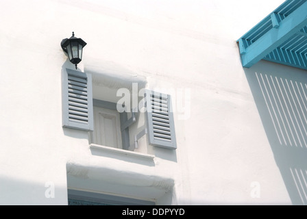 Vintage gray window on the white wall Stock Photo