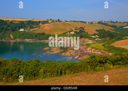 Talland Bay between Looe and Polperro Cornwall England UK with rich colour on a beautiful blue sky sunny day in HDR Stock Photo