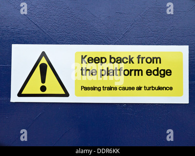 Keep back from the platform edge sign on train station UK Stock Photo