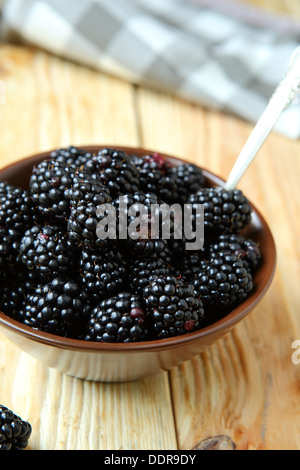 ripe and juicy blackberries in a bowl, food close up Stock Photo