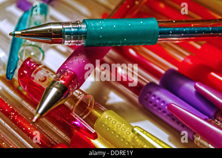 Six colourful glitter pens Stock Photo - Alamy